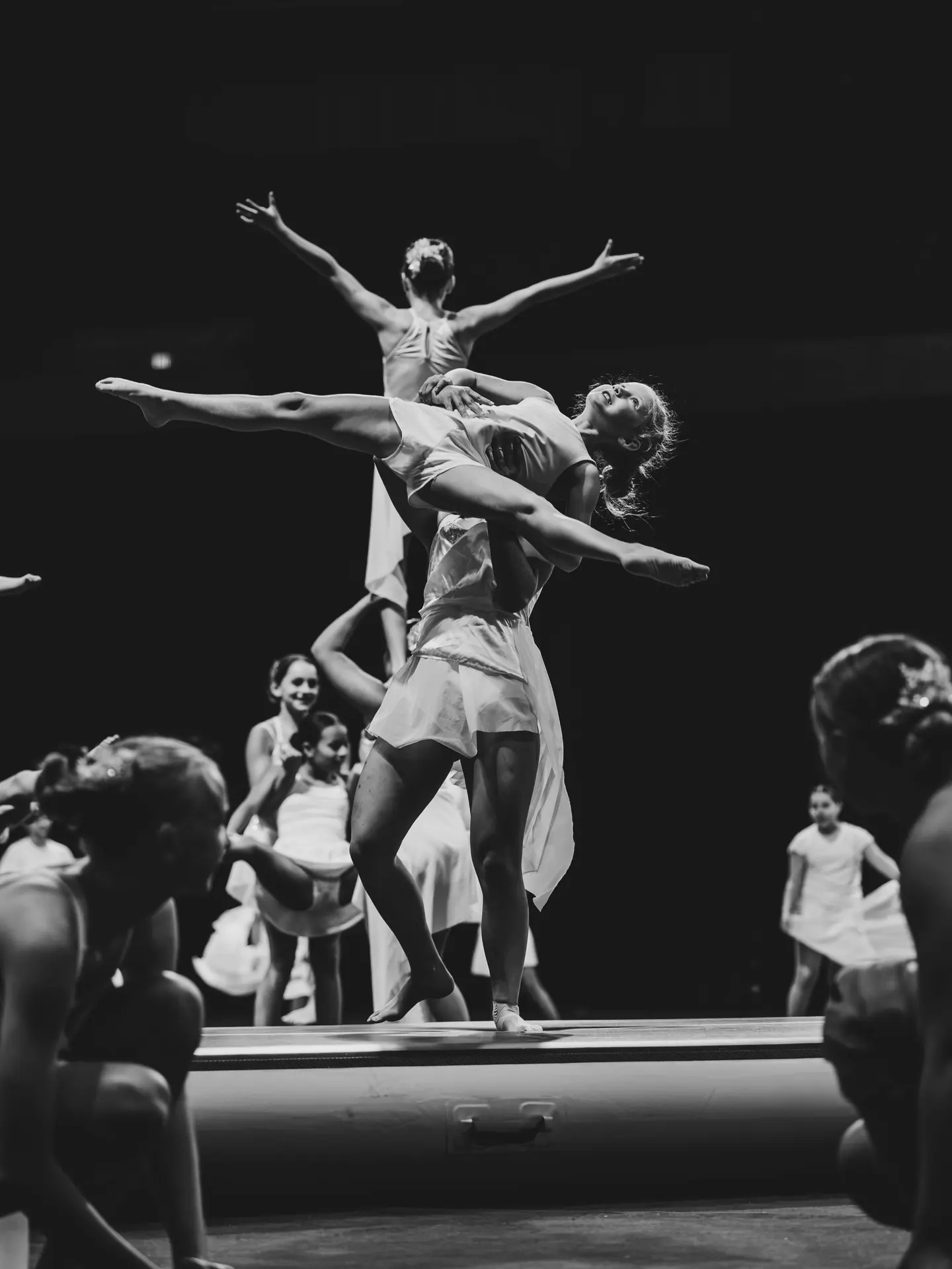 An acrobatic lift, black and white