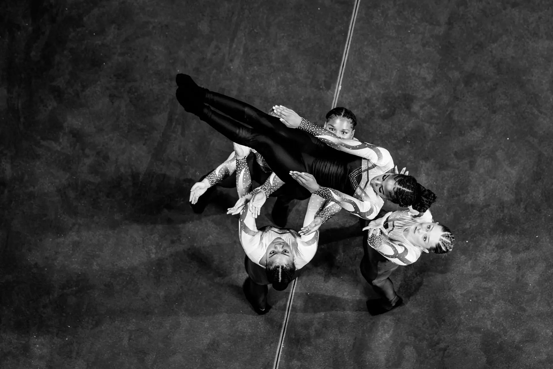 A formation of performers seen from above